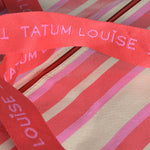 Durable red and pink handles on the Peony Pink TATUM LOUISE bag. 