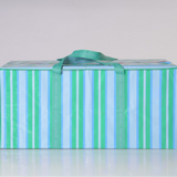 Green and blue striped moving bag with a red zipper on a white ground.