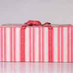 Reusable moving bag for college with red and white striped design and heavy duty red handles.